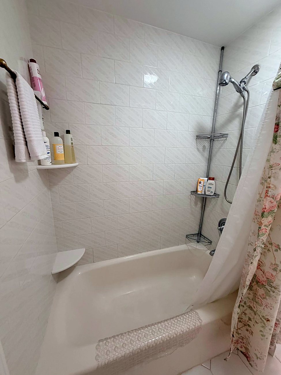 Shared guest bathroom with tub and shower at Wellesley Boutique Inn